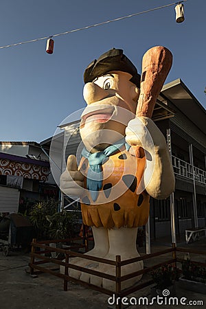 Large Fred Flintstone Statue in Pai, Thailand Editorial Stock Photo