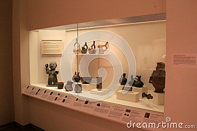 Large glass case with historic artifacts, Memorial Art Gallery, Rochester New York, 2017 Editorial Stock Photo