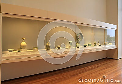 Large glass display with many clay and china items, Cleveland Art Museum,Ohio,2016 Editorial Stock Photo
