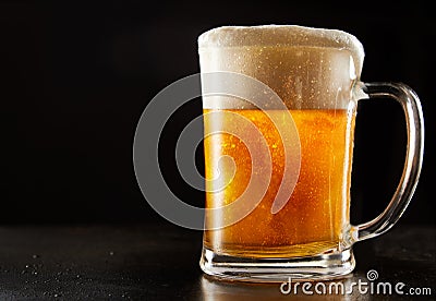 Large glass mug of effervescent chilled glitter beer Stock Photo