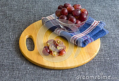 Large grapes in a glass bowl, chopped grapes. Stock Photo