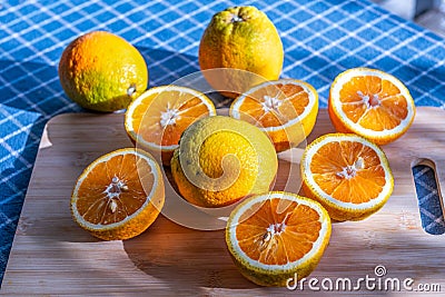 Large greek oranges, halved and ready to be squeezed for some golden, delicious juice Stock Photo