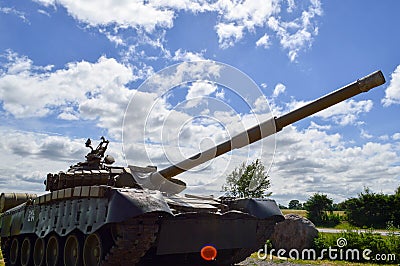 A large green military metal armored deadly dangerous iron Russian Syrian battle tank with a gun turret and a goose Stock Photo