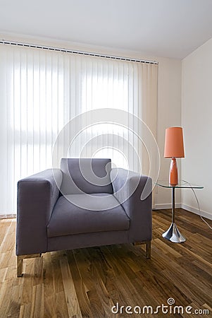 Large grey armchair with a coffee table Stock Photo