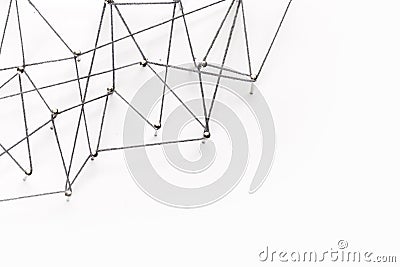 A large grid of pins connected with string. Communication, netwA large grid of pins connected with string. Communication, network Stock Photo