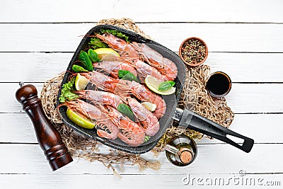 Large grilled shrimp in a frying pan. Stock Photo