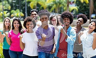 Large group of cheering african american and caucasian and hispanic and latin young adults Stock Photo