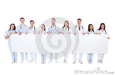 Large group of doctors and nurses with a banner Stock Photo