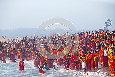 Large group of Hindu people in red clothes Editorial Stock Photo