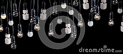 Large group of lamps in receptacle on black Stock Photo