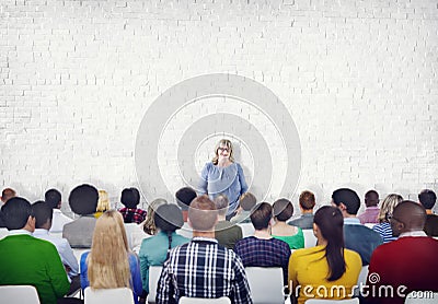 Large Group of People Listening to the Speaker Stock Photo