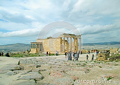 Large Group of People Visiting the Erechtheion Ancient Greek Temple on the Hilltop of Acropolis, Athens, Greece Stock Photo