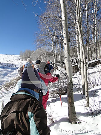 Large group of snowshoe hikers Stock Photo