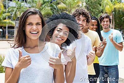 Large group of successful multi ethnic young adults in line Stock Photo