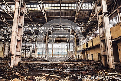 Large hall with columns of abandoned warehouse buildin Stock Photo