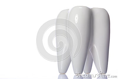 Large healthy looking ceramic 3D tooth model isolated on white background Stock Photo