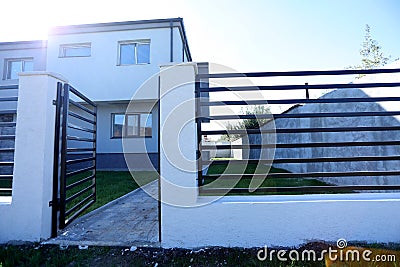 House with opened gates, exterior view Stock Photo