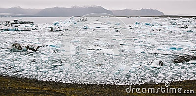 Large icebergs detached from the tongue of a glacier reaching the coast, in Iceland, paradise for adventurers Stock Photo