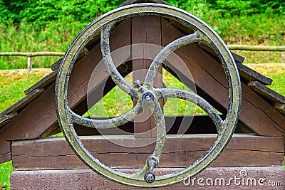 Large iron wheel for the well Stock Photo