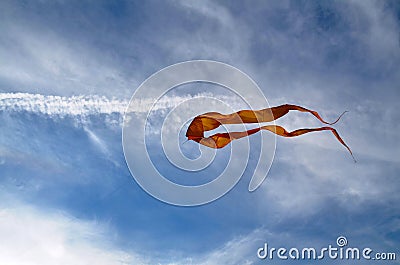 A large kite made of silk of yellow color Stock Photo