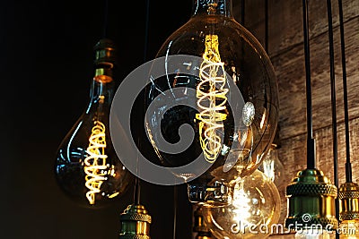 Large LED lamps in retro style with a brightly burning filament against a dark background. close-up Stock Photo