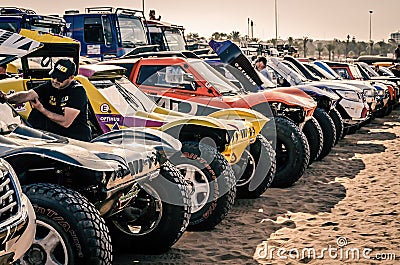 Large line up of rally raid cars and buggies on the beach of Agadir. Morocco Desert Challenge 2023. Editorial Stock Photo