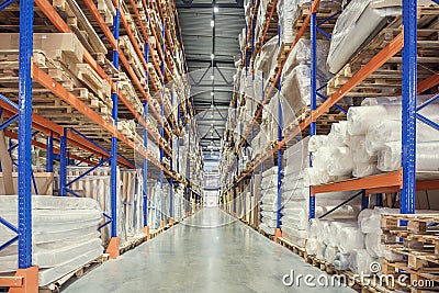 Large Logistics hangar warehouse with lots shelves or racks with pallets of goods. Industrial shipping and cargo delivery Stock Photo