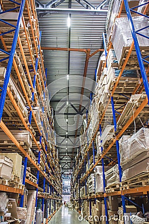 Large Logistics hangar warehouse with lots shelves or racks with pallets of goods. Industrial shipping and cargo delivery Stock Photo