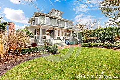 Large luxury green craftsman classic American house exterior. Stock Photo