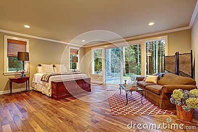 Large master bedroom wth hardwood floor. Stock Photo