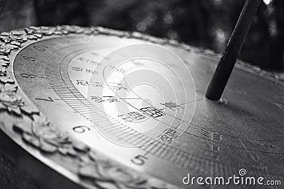 Large metal sundial with Chinese characters. Stock Photo