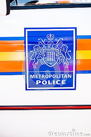 Large Metropolitan Police sign on the side of a white patrol vehicle. Editorial Stock Photo