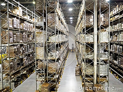 Large modern blurred warehouse industrial and logistics companies. Warehousing on the floor and called the high shelves Stock Photo