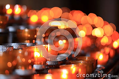 Candlelights, tealights in blurry background Stock Photo