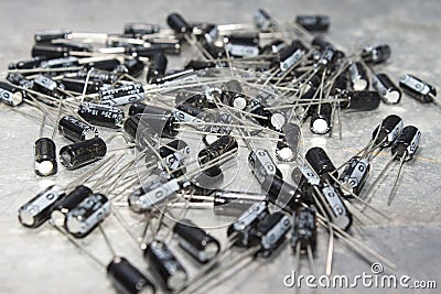 Large number of capacitors are located on a computer table. Stock Photo