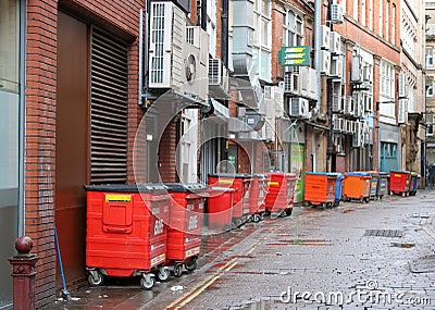 General waste bins in back street in Manchester Editorial Stock Photo