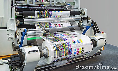 Large offset printing press or magazine running a long roll off Stock Photo