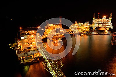 The large offshore oil rig at night Stock Photo