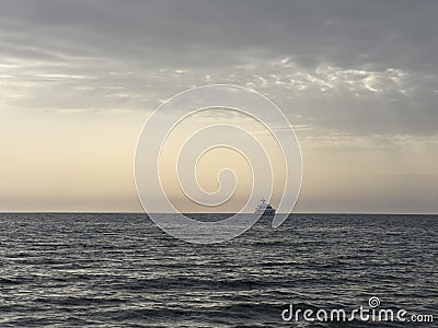 large offshore tourist ship in the sea at sunset Stock Photo