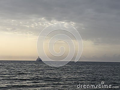 large offshore tourist ship in the sea at sunset Stock Photo