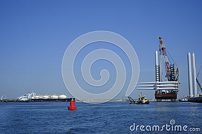 A large offshore vessel with a crane and a helipad is moored in the seaport of Rotterdam. A Jack-up vessel for use in the offshore Editorial Stock Photo