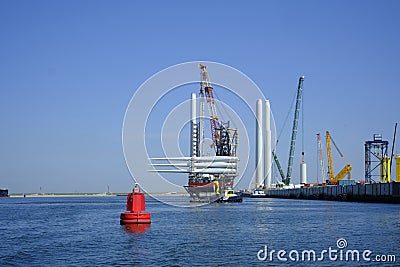 A large offshore vessel with a crane and a helipad is moored in the seaport of Rotterdam. A Jack-up vessel for use in the offshore Editorial Stock Photo