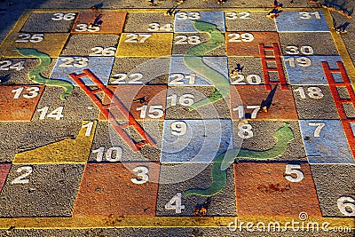Large outdoor snakes and ladders game Stock Photo