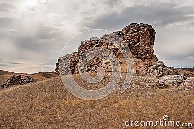 Large outlier on a hill in the steppe. Stock Photo