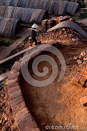 Large ovens, kilns, used to cure clay bricks in Vietnam Editorial Stock Photo