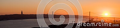 Large panoramic view of Amazing sunset on Ponte 25 de Abril Bridge, 25th of April Bridge at Lisbon Stock Photo