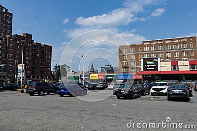 Large Parking Lot with Cars and Restaurants in Astoria Queens New York Editorial Stock Photo