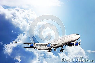 Large passenger plane in blue sky Stock Photo