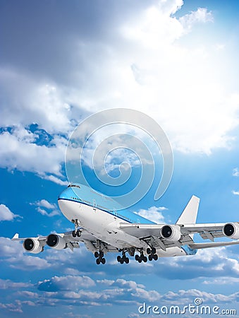Large passenger plane in blue sky Stock Photo
