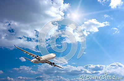 Large passenger plane in blue sky Stock Photo